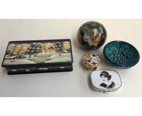 A selection of items including a Russian lacquered box with mother of pearl inlay, two pill boxes, two enamel badges, a small