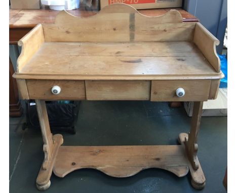 A French pine wash stand with two drawers with ceramic handles, with three quarter gallery top, 94cmW 