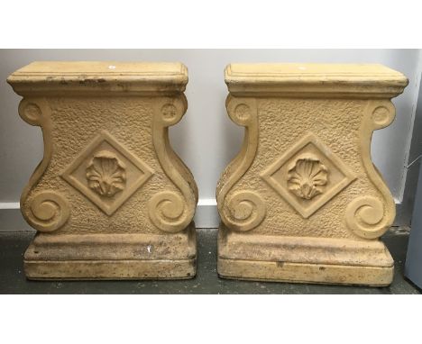 A pair of composite stone bench supports/plinths