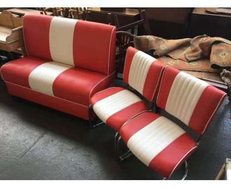 A 1950s diner style bench in red and white, together with two matching chairs with chrome legs 
