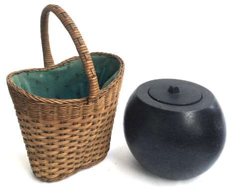 An early 20th century wicker wine basket lined with patterned cotton; together with an unusual ceramic oil burner 