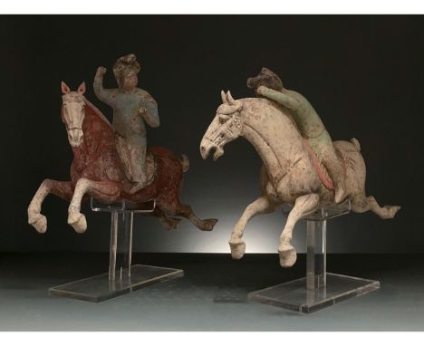 C. AD 618 and 907. Tang Dynasty. A set of two ceramic female polo players. These two ceramics show two women in the midst of 