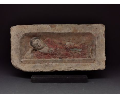 C. 386-534 AD. Northern Wei Dynasty. A painted brick featuring a reclining Buddha figure placed within a rectangular recess. 