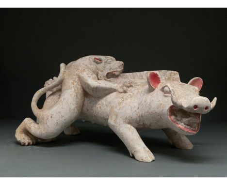 Ca. 206 BC–220 AD Chinese Han Dynasty. Ceramic figure showing a tiger hunting a boar. This elaborate ceramic figure shows a t