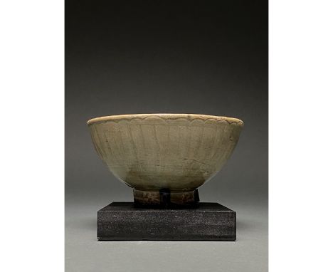 c. 1271-1368 AD. Yuan Dynasty. Celadon bowl with ring foot, wide hemispherical bowl, and a simple rim, rounded rim which is o