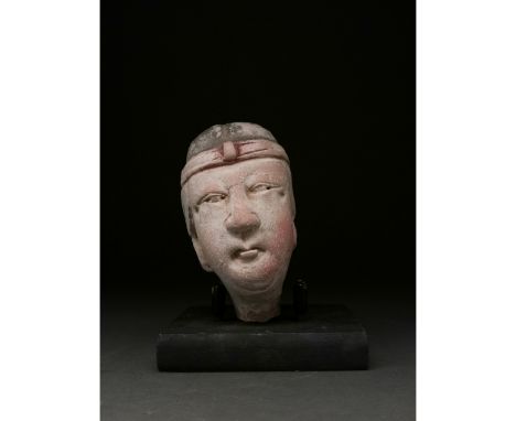 Ca. 206 BC - 220 AD. Han dynasty. A terracotta head of a warrior painted with ruddy skin, a broad nose, and a dark hair arran