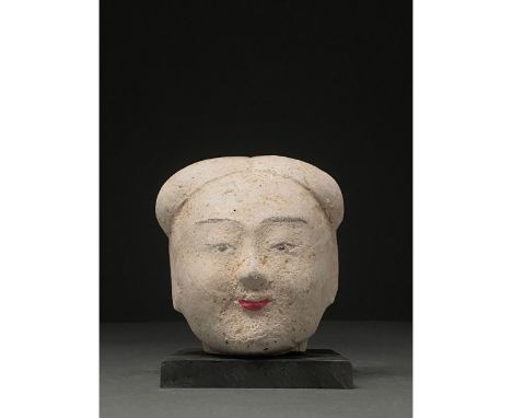 Ca. 206 BC - 220 AD. Han dynasty. A terracotta head of an attendant with pale painted skin, thin arching brows painted black,
