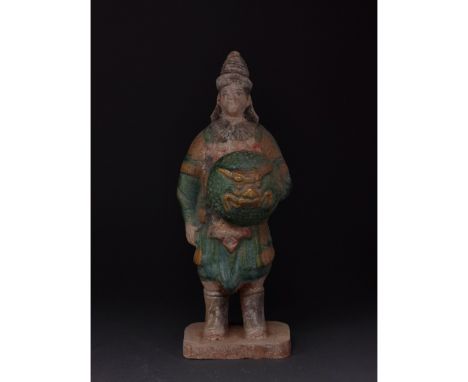 Ca. 1368-1644 AD. Chinese Ming Dynasty Warrior Figure. An elaborately crafted warrior attendant figure dressed and orange and