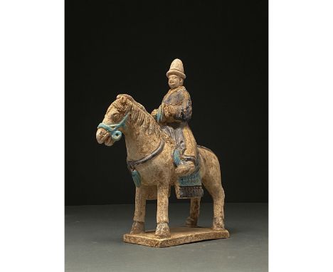 Ca. 1368-1644 AD. Ming Dynasty. Ceramic Horse with Rider. An elegant ceramic figurine depicting a grey horse in a standing po