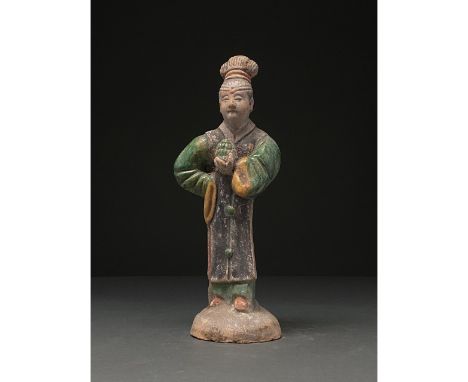 Ca. 1368-1644 AD. Ming Dynasty. Ceramic court lady. This female figure is presented wearing court attire, or shenyi, which co