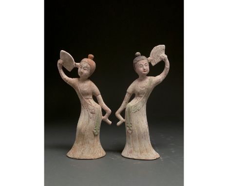Ca. 700 AD. Tang Dynasty. Pair terracotta court ladies with fans. This pair of ceramic court ladies are presented wearing flo