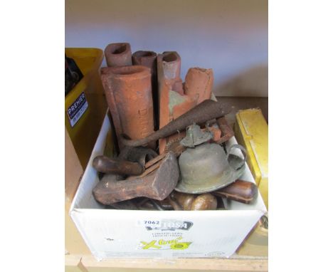 A box containing tool heads, drain pipes etc 
