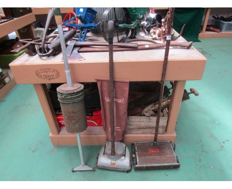 Three vintage vacuum cleaners