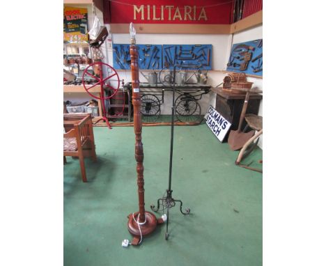 A turned oak standard lamp and an adjustable standard lamp