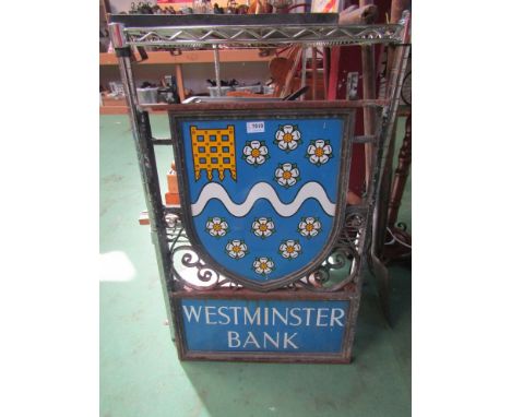 A Westminster Bank double sided enamel sign in wrought iron frame 