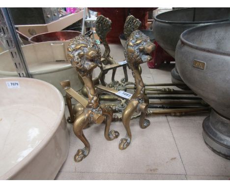 Brass lion head fire dogs and fire tools 