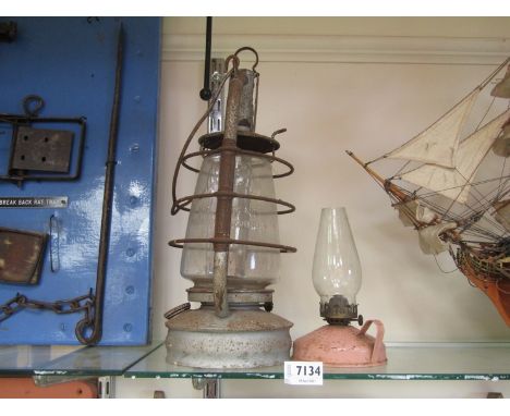 A BAT hurricane lamp and a chamber oil lamp 