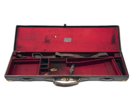 A BRASS-CORNERED LEATHER SINGLE HAMMERGUN CASE, fitted for 30in. barrels, the interior lined with red baize, brass lock (key 