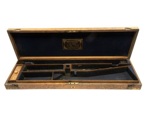 A VINTAGE BRASS-CORNERED OAK SINGLE GUNCASE, fitted for 30in. barrels, the interior lined with blue baize, a RichD Burnand tr