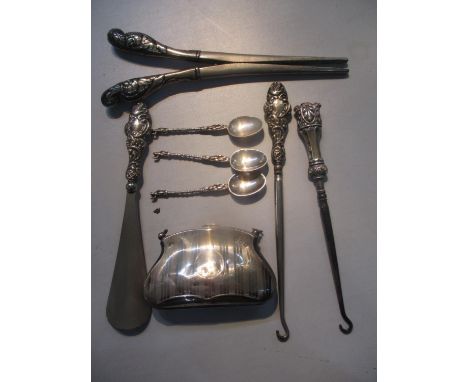 A selection of silver and white metal to include a purse, glove stretchers, button hooks and other items 