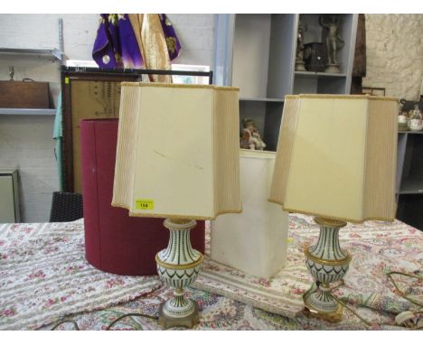 A pair of Italian Magami table lamps having a white porcelain round with gilt and green leaf detail, together with mixed lamp