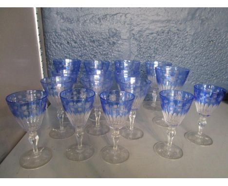 A set of five Stevens and Williams light blue flashed wheel engraved and cut wine glass and six matching sherry glasses and f