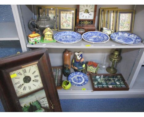 Two American clocks and miscellaneous household items to include a Dartmouth gurgling jug, collectors stones and an oil lamp 