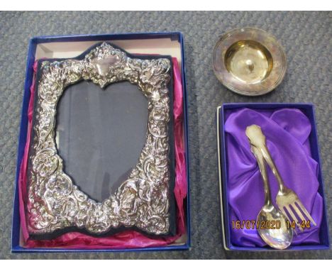 A silver photo frame, an Armada dish and a continental child's spoon and fork 