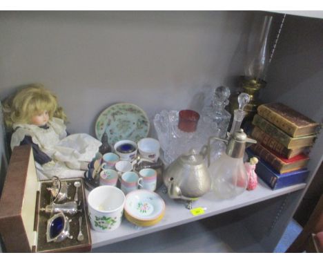 A mixed lot to include an oil lamp, Claret jug, books, Dalton figure entitled Rose HN1368, a doll cased walker and Hall silve