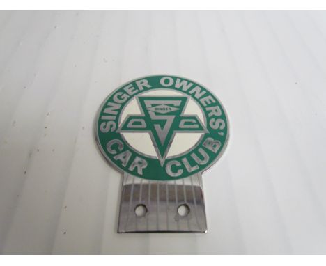 A chrome and enamel singer owners Car Club badge 