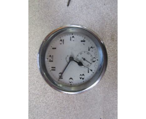 A chromed 8-day dash clock 