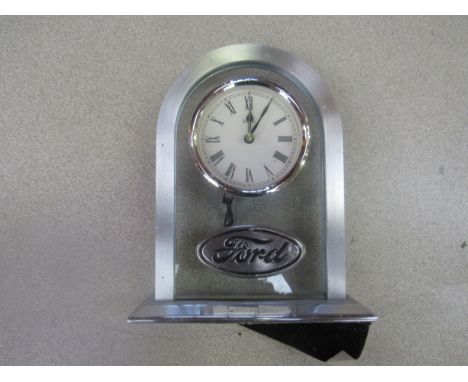 A chromed Ford dash clock and a Ford presentation clock (2) 