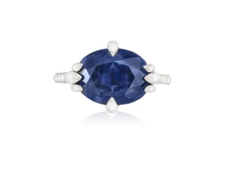 A SAPPHIRE AND DIAMOND RING, BY CARTIERThe central oval-shaped sapphire weighing approximately 5.00cts within eight-claw sett