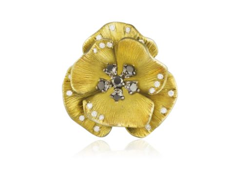 A DIAMOND AND TITANIUM COCKTAIL RING, BY MARGHERITA BURGENERDesigned as a stylised flowerhead, the textured greenish-yellow t