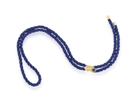 A GEM-SET LARIAT NECKLACE, BY BULGARIThe blue cord lariat with a gold zip-like slider set with a sapphire cabochon, with step