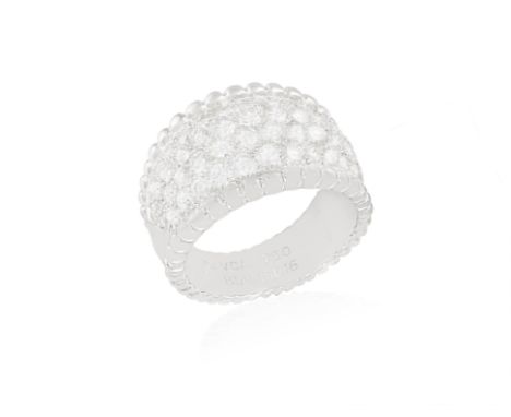 A DIAMOND ‘PERLÉE’ RING, BY VAN CLEEF & ARPELSThe slightly bombé ring of tapering design and pavé-set to the front with brill