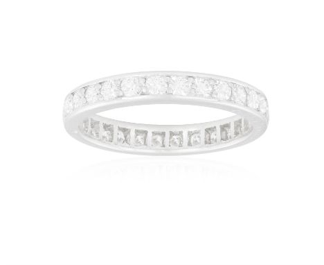 A DIAMOND ETERNITY RING, BY CARTIERThe continuous line of brilliant-cut diamonds within claw-setting, mounted in platinum, si