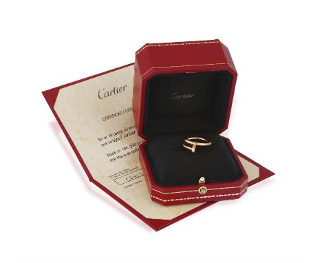 A GOLD 'JUSTE UN CLOU' RING, BY CARTIERDesigned as a wrap-around nail, in 18K rose gold, signed Cartier, maker's mark, number