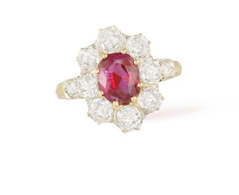 A RUBY AND DIAMOND CLUSTER RINGThe cushion-shaped ruby weighing approximately 2.15cts within a surround of old brilliant-cut 