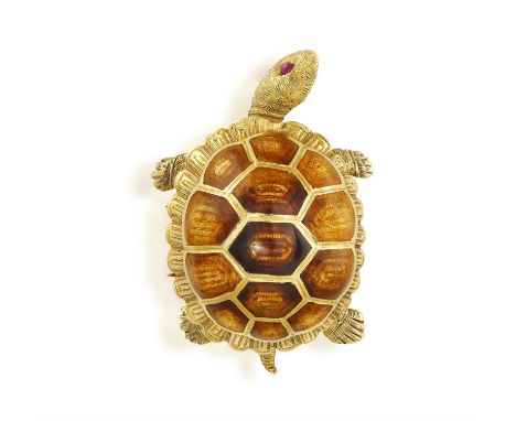 AN ENAMEL AND RUBY NOVELTY BROOCH, CIRCA 1955The turtle shell decorated with gold and brownish gold enamel between textured g