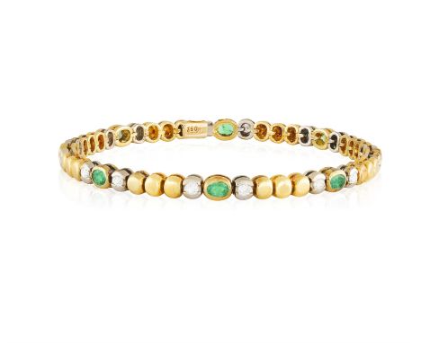 AN EMERALD AND DIAMOND BRACELETComposed of oval-shaped emeralds set between brilliant-cut diamonds and circular polished gold