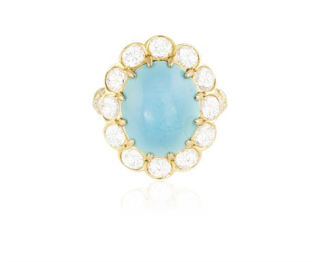 A TURQUOISE AND DIAMOND DRESS RINGSet with an oval-shaped turquoise cabochon at the centre, within a surround of brilliant-cu