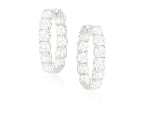 A PAIR OF DIAMOND EARRINGSEach hoop set with brilliant-cut diamonds to the front and back, mounted in 18K gold, diamonds appr