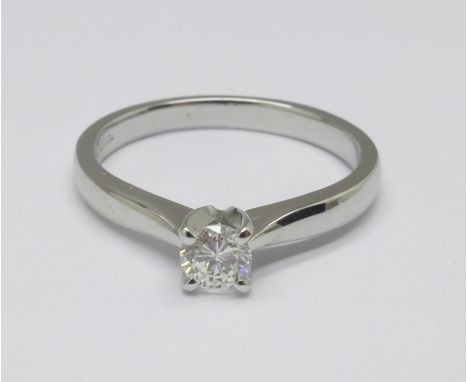 A platinum set diamond solitaire ring, 4g, M