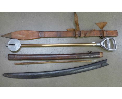 A Kenya Prisons swagger stick, an aluminium shooting stick, and three sword scabbards comprising one Japanese, one Sudanese a