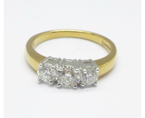 An 18ct yellow gold and three stone diamond ring, 3.9g, N, 0.7 carat diamond weight