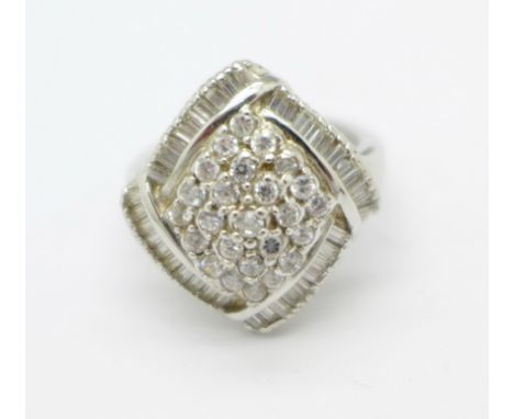 A large silver white stone set ring, O