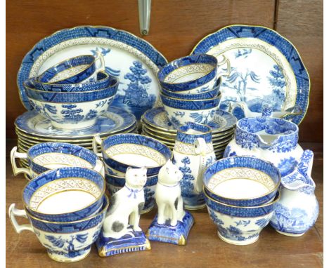 Booth's Real Old Willow china, a Copeland Spode jug, a/f, and a pair of Staffordshire cats