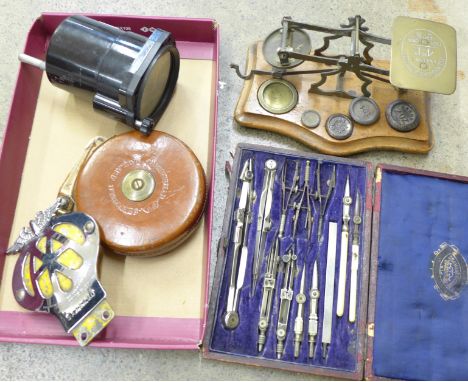 An aircraft altitude gauge to 45,000ft, a set of postal scales and weights, a set of drawing instruments, an AA badge and a s