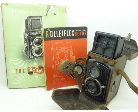A Rolleiflex camera, guide and book